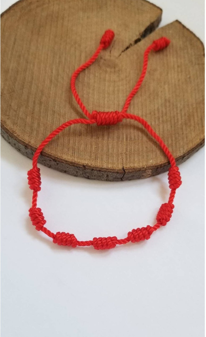 Red string bracelet with 7 knots for wishes and protection