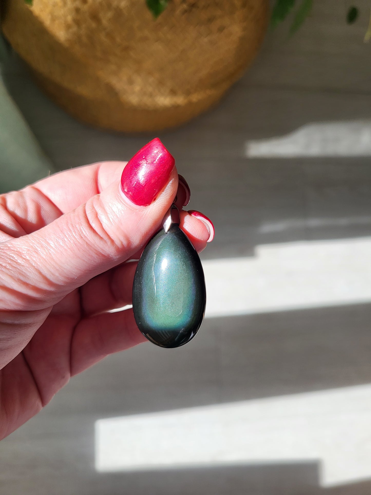 Necklace with celestial eye obsidian pendant.