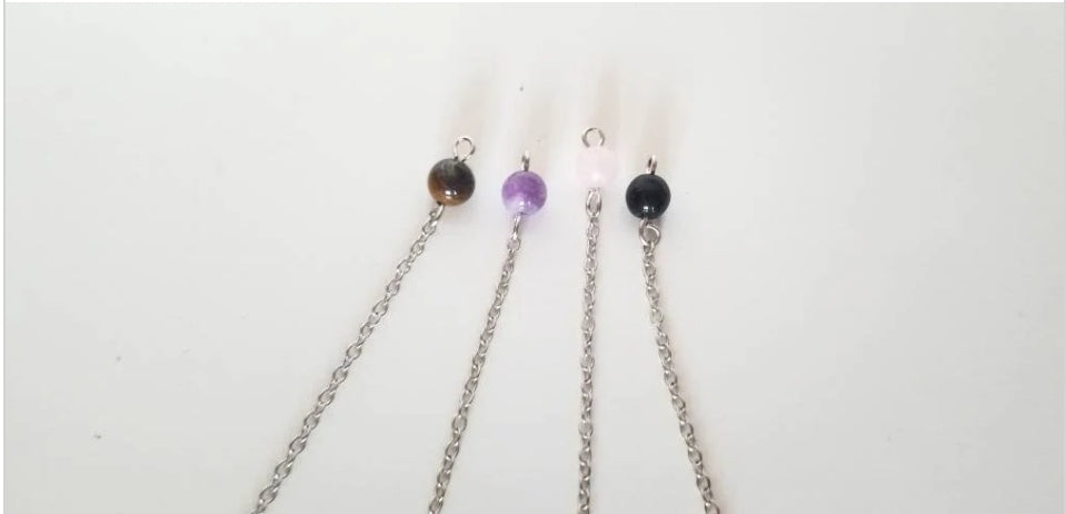 Pendules divinatoires en quartz rose, oeil de tigre, onyx, améthyste ou quartz