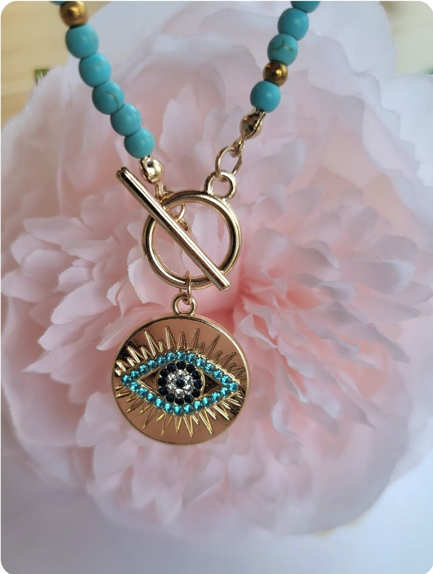 Necklace with protective eye medallion