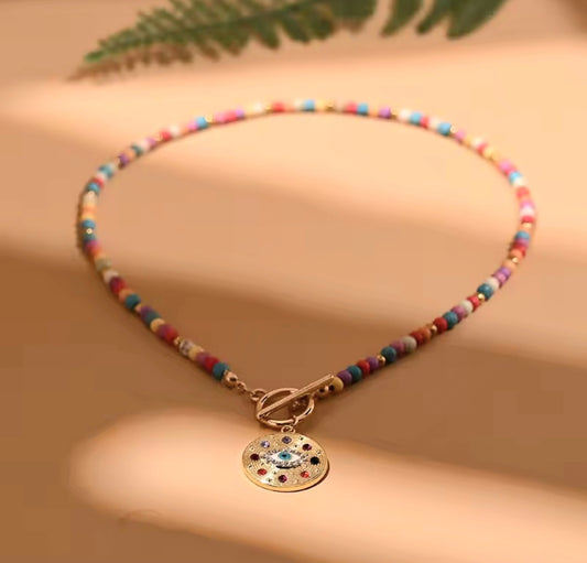 Necklace with protective eye medallion