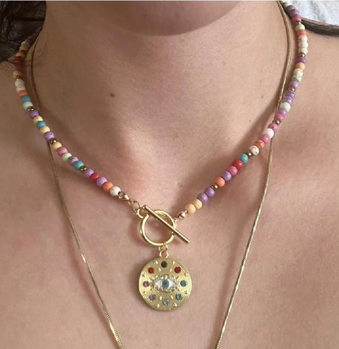 Necklace with protective eye medallion