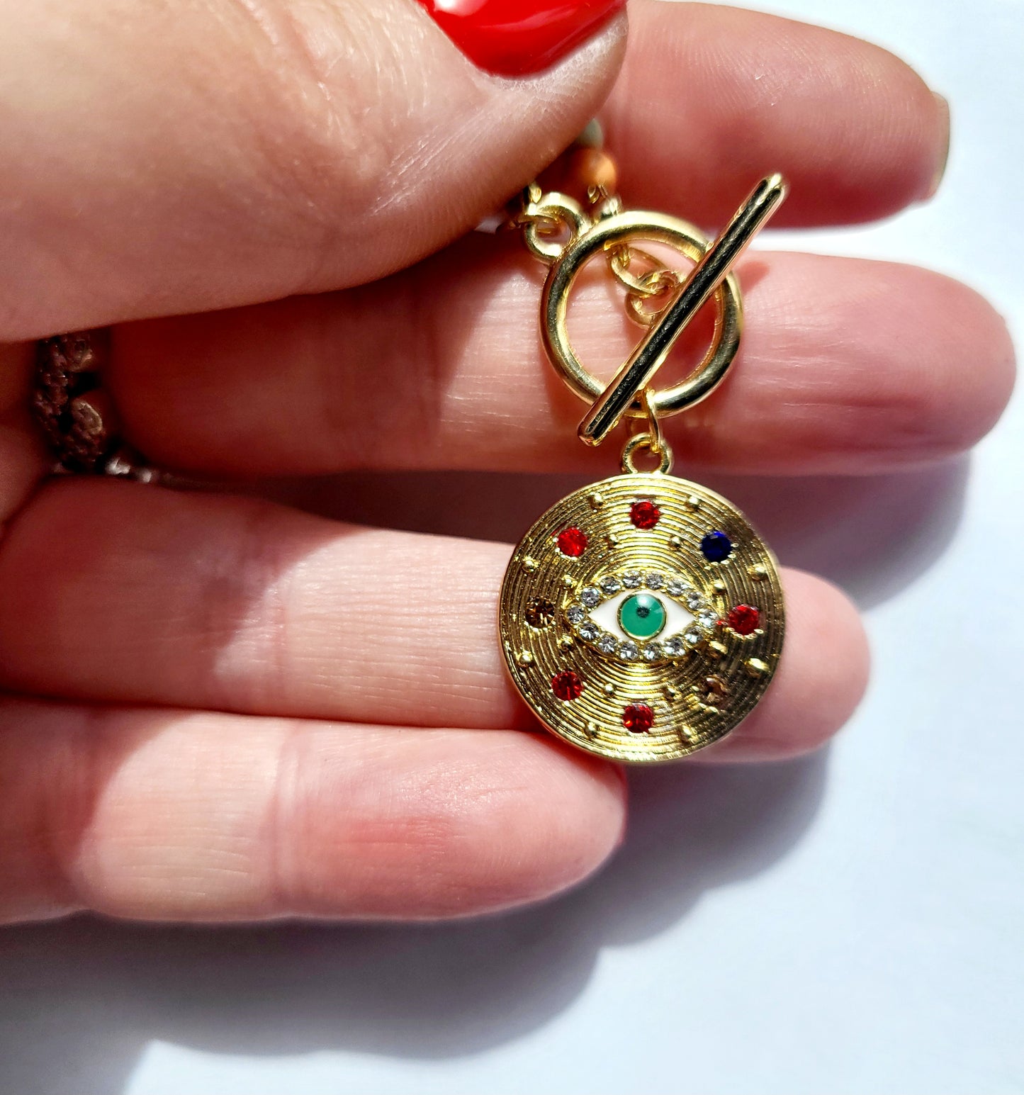 Necklace with protective eye medallion